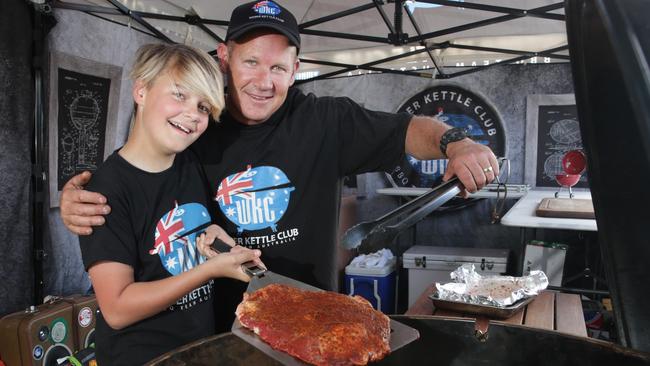 Flynn Hogston, 11 pictured with dad Joel. Flynn recently won the Australasian Barbecue Alliance's first ever junior competition making him Australia's first "junior pitmaster" (AAP image/Mark Scott)