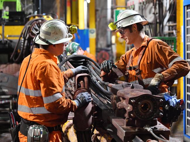 BHP workers are seen during a tour of the Olympic Dam mine site in Roxby Downs, South Australia, Friday, August 30, 2019. BHP officially launched its Underground School of Excellence at Olympic Dam, for people without experience in mining. (AAP Image/David Mariuz) NO ARCHIVING