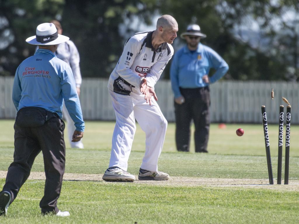 Liam White watches a direct hit at stumps by Neel Patel.