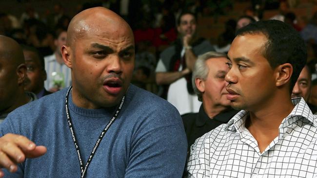 Charles Barkley (L) and Tiger Woods in happier times.