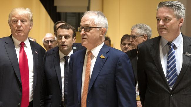 Malcolm Turnbull and Mathias Cormann with Donald Trump and French president Emmanuel Macron. Source: Supplied.