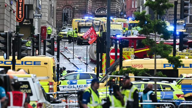 Ambulances and police vans at the scene of the incident in Water Street, on the sidelines of an open-top bus victory parade for Liverpool's Premier League title win, in Liverpool. Picture: AFP