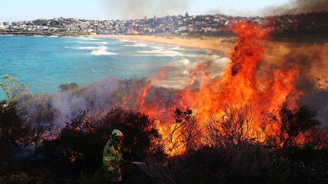 The hazard reduction burn came close to houses but firefighters said they had it under control. Picture: David Swift