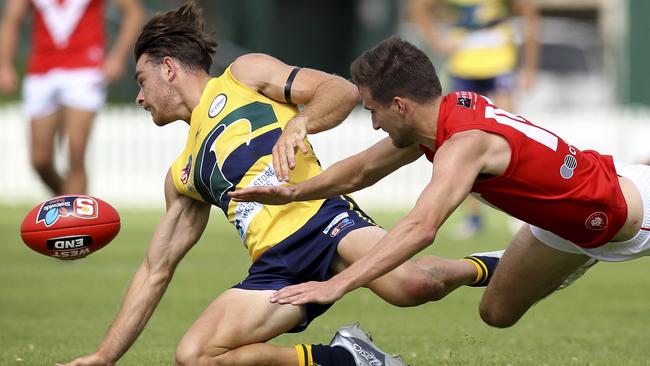 Eagles recruit Jordan Foote beats North's Tom Schwarz to the footy. Picture: AAP Image/Dean Martin