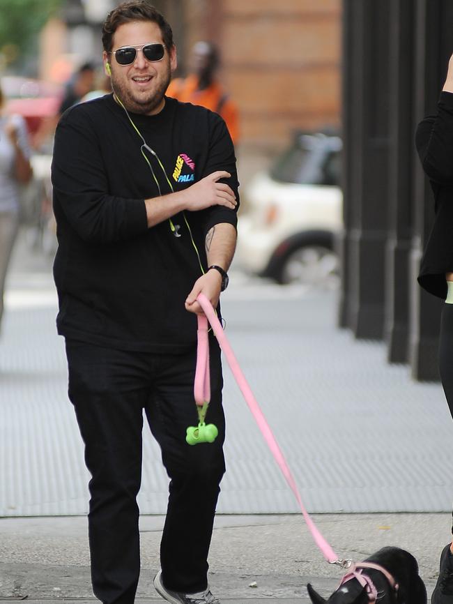 Hill walks his dog in Soho last week.