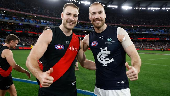 MELBOURNE, AUSTRALIA - JUNE 09: Ben McKay of the Bombers and brother Harry McKay of the Blues pose after the 2024 AFL Round 13 match between the Essendon Bombers and the Carlton Blues at The Melbourne Cricket Ground on June 09, 2024 in Melbourne, Australia. (Photo by Michael Willson/AFL Photos via Getty Images)