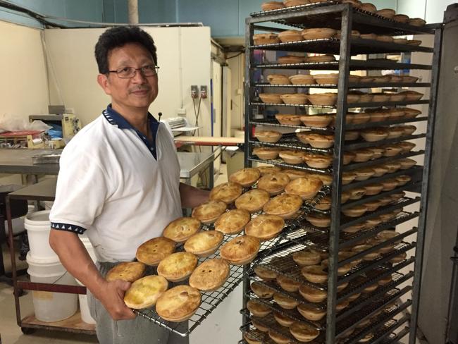 La Bakehouse Cafe’s Dong Ngu Vuong with a rack of pies.