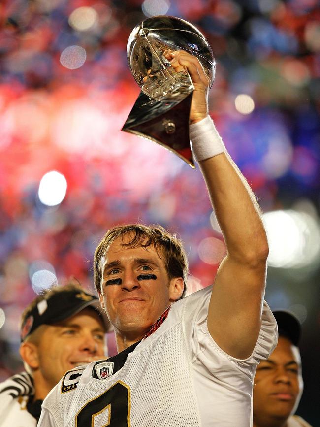 Brees holds up the Vince Lombardi Trophy after defeating the Indianapolis Colts in Super Bowl XLIV. Picture: Jonathan Daniel/Getty Images/AFP