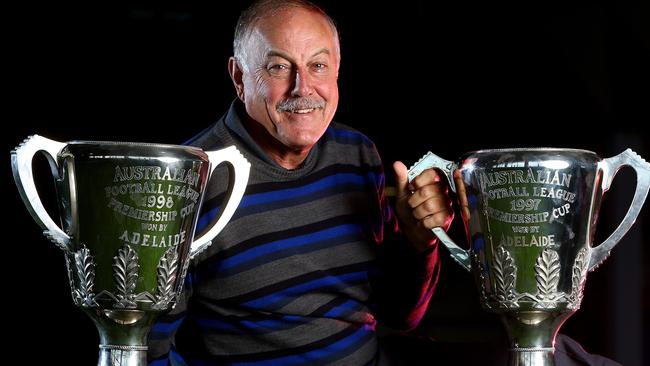 Former Adelaide coach Malcolm Blight with the two premiership cups he won during his time in Adelaide. Picture: Sarah Reed