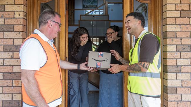 Pop singer Guy Sebastian and delivery partner Brendan McEntee surprise residents at Eastern Creek and Minchinbury in western Sydney.