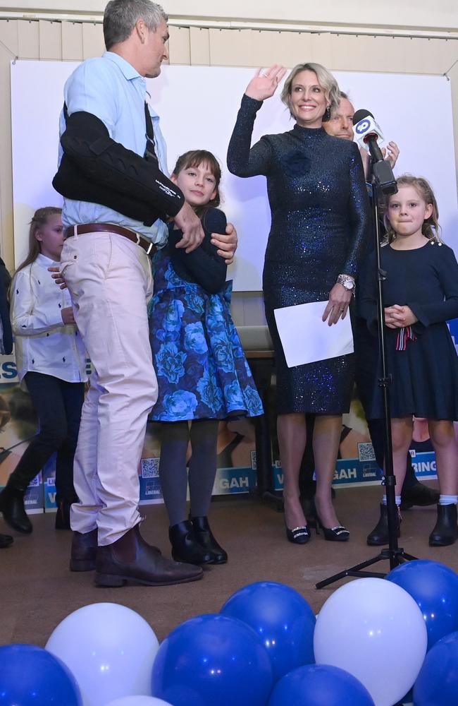 Liberal candidate for Warringah Katherine Deves with her family and former prime minister Tony Abbott during the concession speech at her election party at Balgowlah Bowling Club. Picture: Jeremy Piper