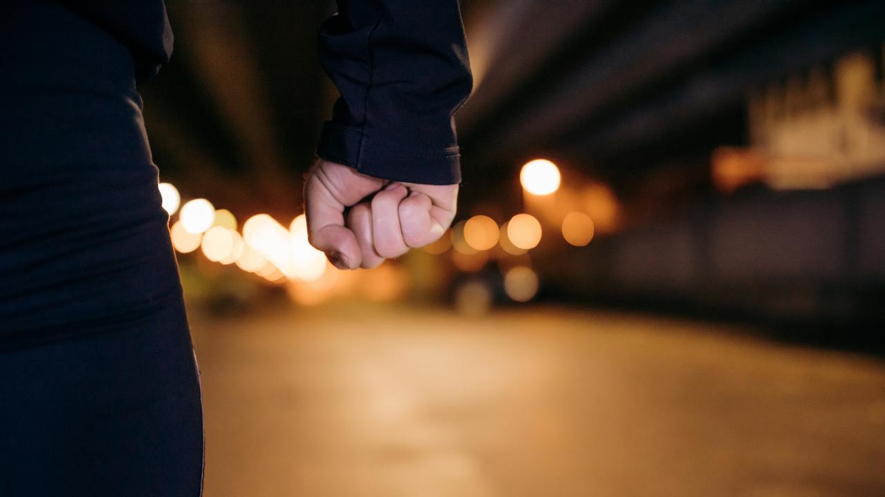 Midsection of man with clenched fist. istock