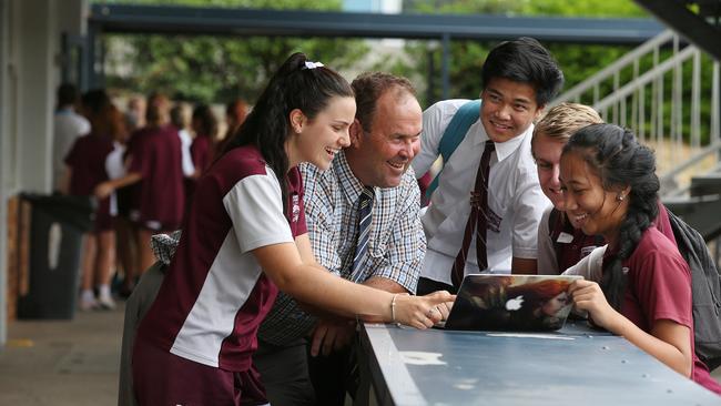 Outside class rooms built in 1963, Beenleigh State High school Principal Matt O'Hanlon, with senior year 12 students, Chloe Squires, Matthew Canafe, Hayden Scudds and Vaiola Mataituu. Lyndon Mechielsen/The Australian