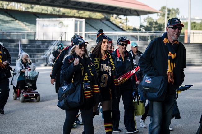 Crows and Port Adelaide fans walking into Adelaide Oval to be extras in film 