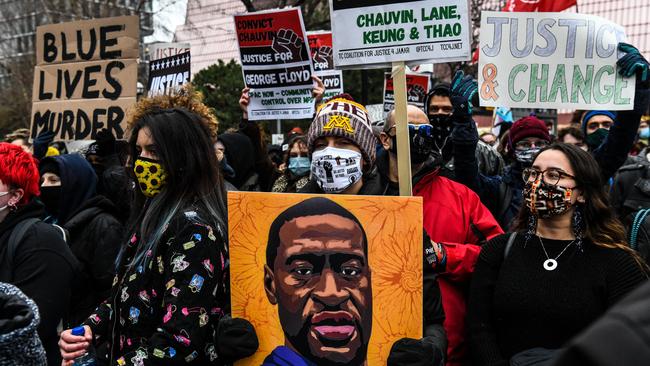 People protest outside of the courthouse during the trial of the former Minneapolis police officer charged with murdering George Floyd in Minneapolis.