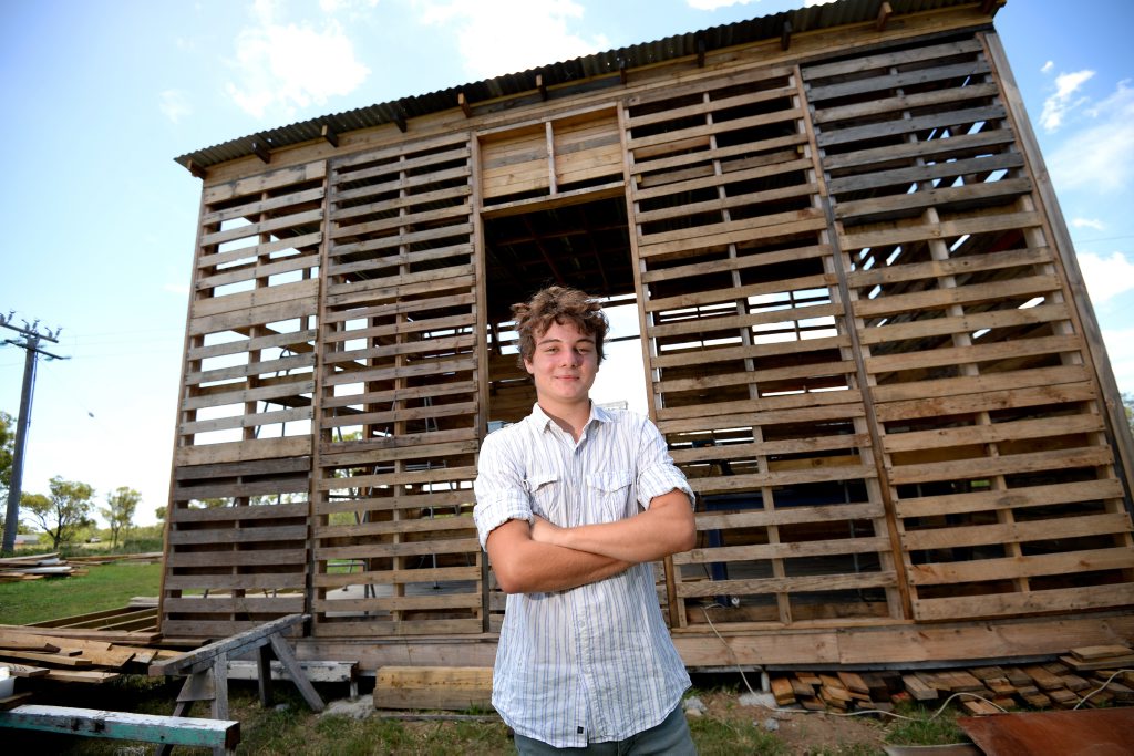 Angus Hughes is constructing a building out of used pallets and other recycled materials. Photo Allan Reinikka / The Morning Bulletin. Picture: Allan Reinikka