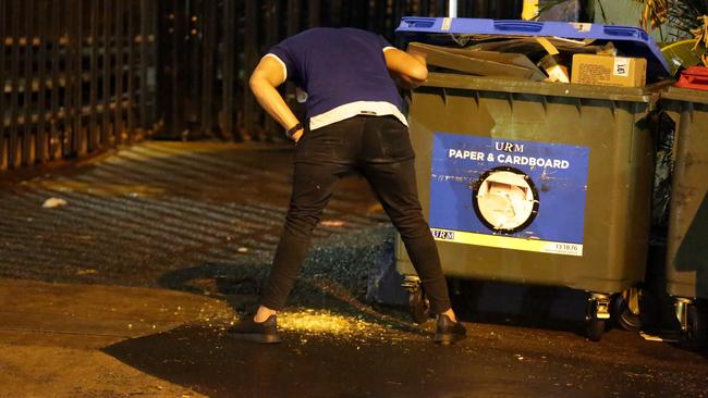 Bulldogs player vomiting on the street during the Bulldogs Mad Monday Celebrations Picture: Christian Gilles