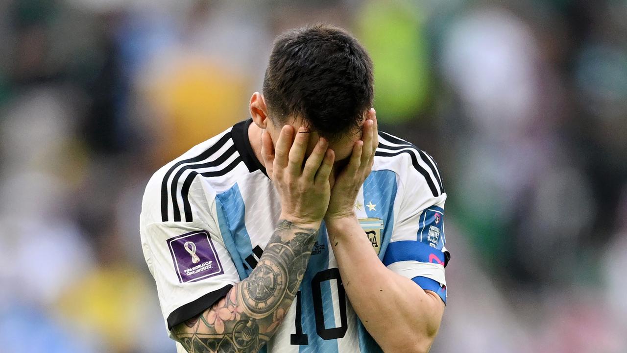 Lionel Messi head in hands after the loss to Saudi Arabia.