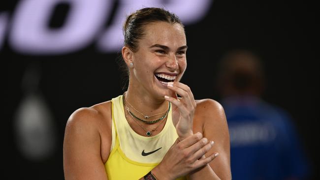 MELBOURNE, AUSTRALIA - JANUARY 23: Aryna Sabalenka smiles while interviewed after winning against Paula Badosa of Spain in the Women's Singles Semifinal during day 12 of the 2025 Australian Open at Melbourne Park on January 23, 2025 in Melbourne, Australia. (Photo by Hannah Peters/Getty Images)