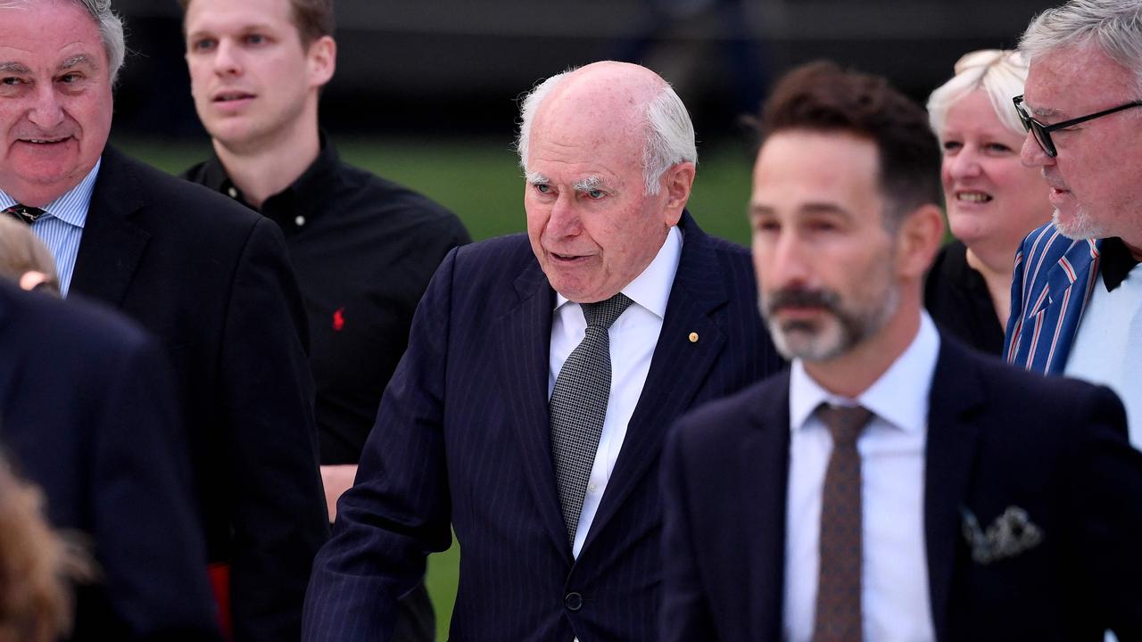 Former Australian Prime Minister John Howard arrives. Photo by William WEST / AFP