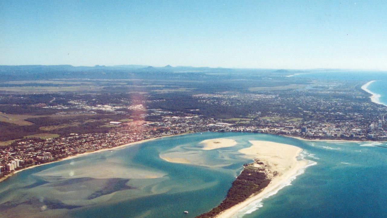 Aerial view over the northern end of Bribie Island showing Golden Beach (right), Bulcock Beach (background) and the channels and waterways of Pumicestone Passage which lead out to the Pacific Ocean, ca 2005.