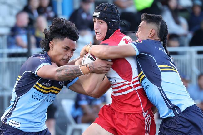 Palm Beach Currumbin SHS halfback Taj Lateo is wrapped up by daring Mabel Park SHS defenders in round 1 of the Langer Trophy. Picture: Liam Kidston
