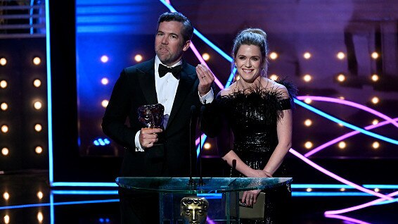 Patrick Brammall and Harriet Dyer present the International Award at the BAFTAs. Picture: Stuart Wilson