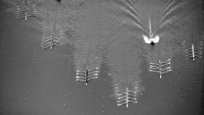 Brisbane Grammar (centre) crosses the line to win the Head of the River on the Hinze Dam in 1981. Picture: Ted Holliday