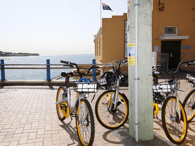 A group of hire bikes left outrside Coogee Surf Club. Picture: John Appleyard