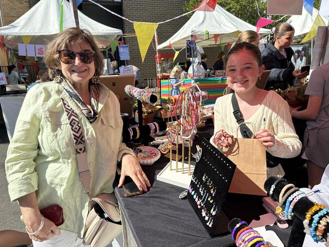 Lisa Mayoh's 'Aunty Jo' and hardworking daughter Elena, 11, who makes bracelets for her jewellery business 'Elena's Jewellery', selling on social media and in local markets.