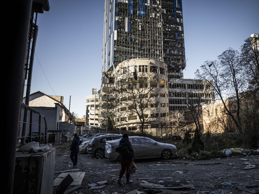 Destroyed cars stand amid damage caused by a missile strike in a residential area near Tower 101 not far from Kyiv's main train station.