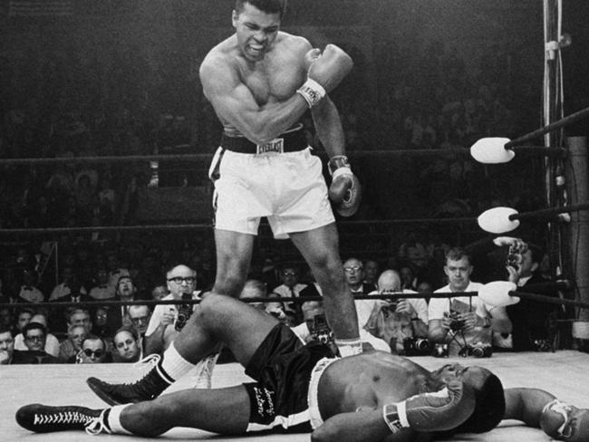 The Greatest, heavyweight champion Muhammad Ali stands over fallen challenger Sonny Liston in 1965. Picture: AP