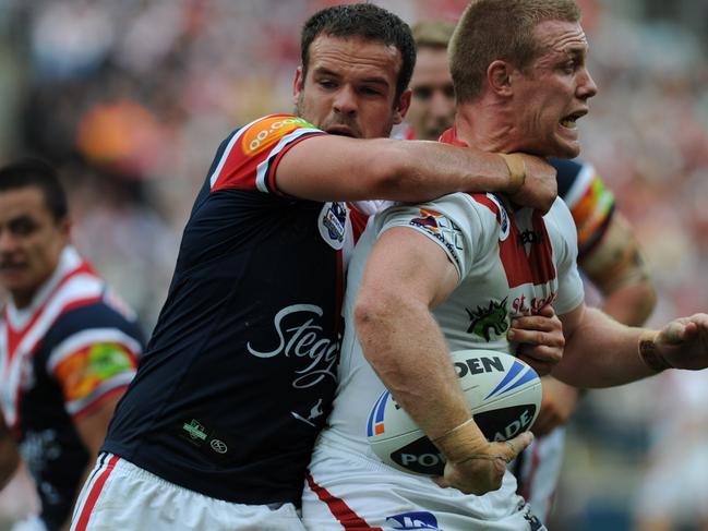 Ben Creagh comes under pressure from a determined Nate Myles. AAP Image/Dean Lewins