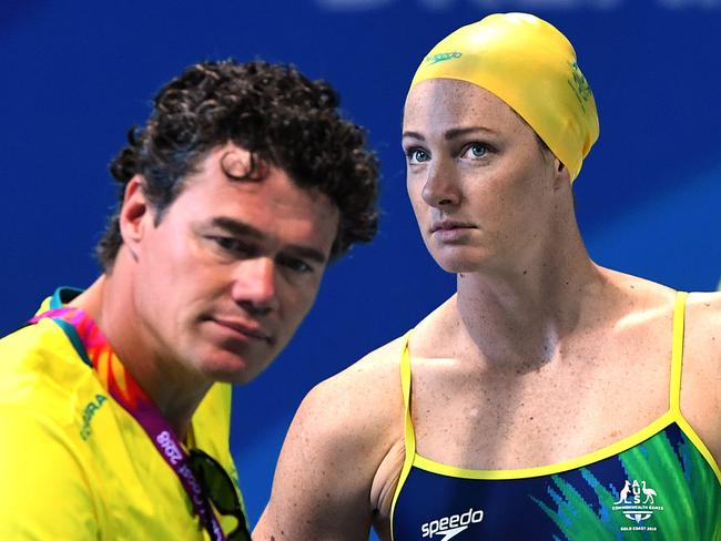 Australian head coach Jacco Verhaeren (left) is seen with Cate Campbell (centre) during the Australian Swim Team training session at the Gold Coast Aquatic Centre at Southport on the Gold Coast, Sunday, April 1, 2018. (AAP Image/Dave Hunt) NO ARCHIVING, EDITORIAL USE ONLY