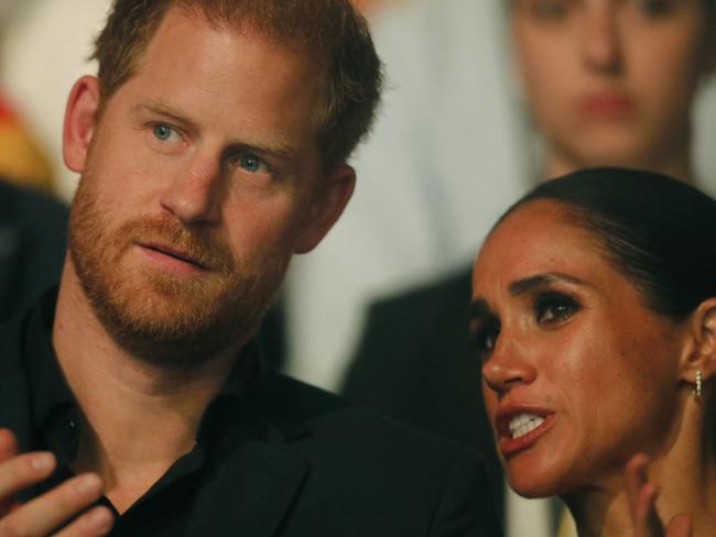 Harry, Duke of Sussex and patron of the Invictus Games (L), and his wife Meghan, Duchess of Sussex, attend the closing ceremony of the 2023 Invictus Games in Duesseldorf, western Germany on September 16, 2023. The Invictus Games, an international sports competition for wounded soldiers founded by British royal Prince Harry in 2014, was taking place from September 9 to 16, 2023 in Duesseldorf. (Photo by LEON KUEGELER / AFP)