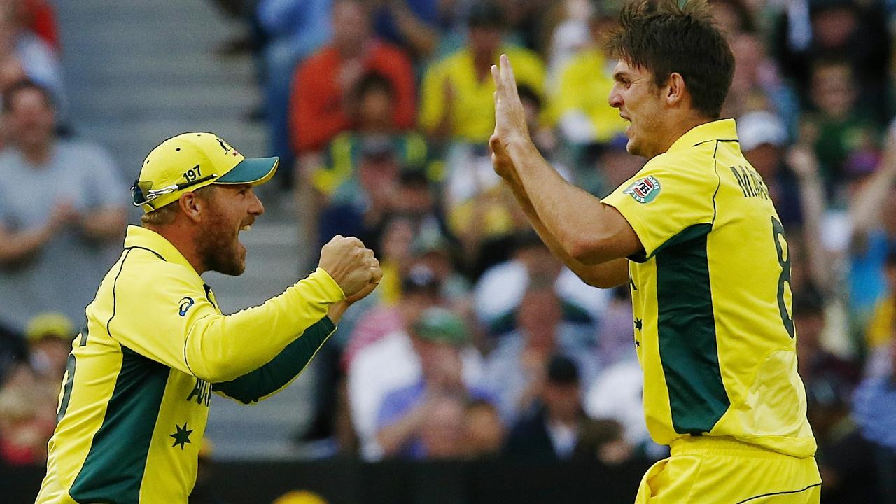 Aaron Finch and Mitch Marsh celebrate a wicket during an ODI.