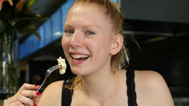 Hunky Dory is popular in Melbourne where it has nine eateries. Pictured is Eddi Meinertz, 20, tucking into some flake (gummy shark) and chips at Hunky Dory in Port Melbourne. Picture: Mark Stewart