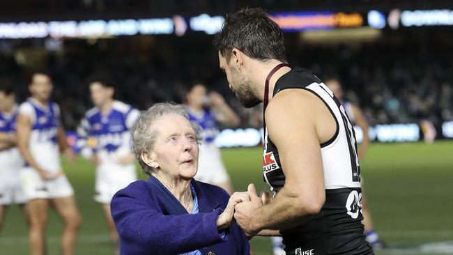 Travis Boak accepts the Peter Badcoe medal for best on ground in the Anzac Round match. Picture SARAH REED