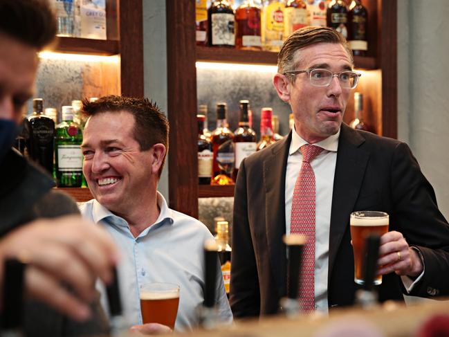 NSW Deputy Premier Paul Toole and NSW Premier Dominic Perrottet share a beer at Watson's Pub. Picture: Adam Yip