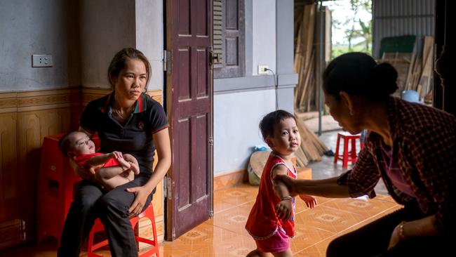 Family members and neighbours of Nguyen Dinh Luong, believed to be one of the 39 people found dead in the refrigerated truck. Picture: Getty