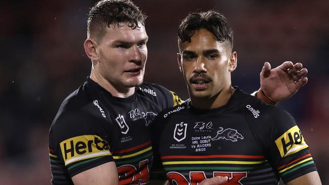 Liam Martin congratulates Daine Laurie on his Panthers debut.