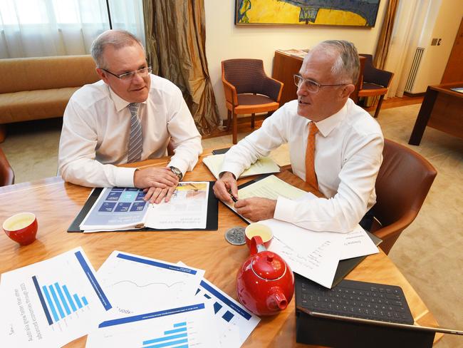 Treasurer Scott Morrison and Prime Minister Malcolm Turnbull go over the Budget papers at Parliament House. Picture: Mick Tsikas.