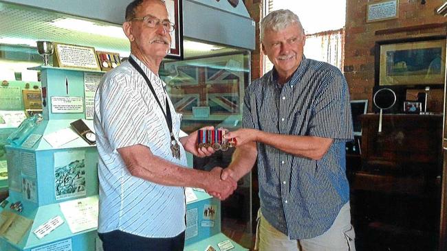 Maryborough and Colonial Museum director John Meyers with Geoffrey Aberdeen who gave his father's war medals to the museum last Saturday.