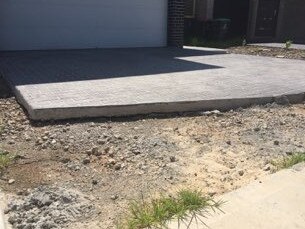 Ground settlement near a driveway on Navy Rd, just around the corner from a demolished house in Jordan Springs East. Picture: Supplied.