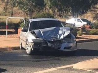 Police at the scene of a car crash in Alice Springs this morning.