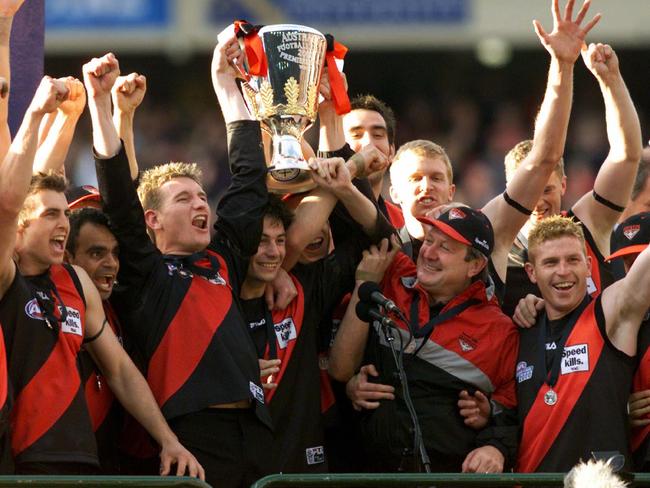 James Hird and Kevin Sheedy lead the Bombers in their premiership celebrations.