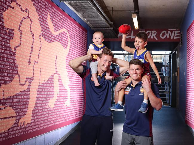 Brisbane Lions players Ryan Lester with son Romeo 8 months-old and Dayne Zorko with son Louis , 4, the Race at the Gabba. Photographer: Liam Kidston.