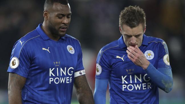 Leicester City's Wes Morgan, left, and Jamie Vardy leave the pitch after the English Premier League match Swansea against Leicester at the Liberty Stadium, Swansea, Wales, Sunday Feb. 12, 2017. (Nick Potts/PA via AP)