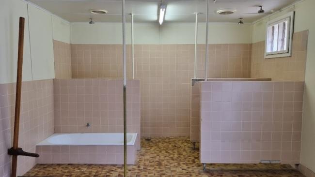 Misbehaving prisoners could be chained to the pole in the shower block. Picture: Kirrily Schwarz