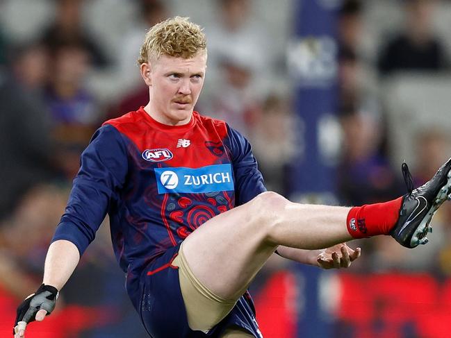 MELBOURNE, AUSTRALIA - APRIL 11: Clayton Oliver of the Demons warms up during the 2024 AFL Round 05 match between the Melbourne Demons and the Brisbane Lions at the Melbourne Cricket Ground on April 11, 2024 in Melbourne, Australia. (Photo by Michael Willson/AFL Photos via Getty Images)